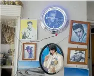  ??  ?? Gladys’ Elvis night light and Elvis pictures.