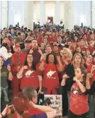  ?? ROBERT RAY/AP ?? Teachers in Charleston, W.Va., celebrate Tuesday after a deal to end a statewide teachers’ strike.