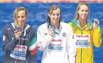  ?? DARKO BANDIC/THE ASSOCIATED PRESS ?? From left, Italy’s gold medal winner Federica Pellegrini, United States’ silver medal winner Katie Ledecky and Australia’s silver medal winner Emma McKeon show off their medals after the women’s 200-meter freestyle final Wednesday at the World Aquatics...