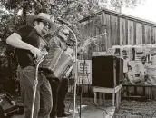  ?? Kin Man Hui / Staff file photo ?? Juan Tejeda, left, performs in May 2019 at a historic and cultural preservati­on community gathering on San Antonio’s west side.