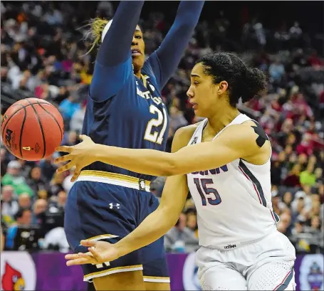  ?? SEAN D. ELLIOT/THE DAY ?? UConn’s Gabby Williams wraps a pass around Notre Dame’s Kristina Nelson during the first half of Friday night’s NCAA Final Four national semifinal at the Nationwide Arena in Columbus, Ohio. Notre Dame stunned the previously unbeaten Huskies 91-89 in...