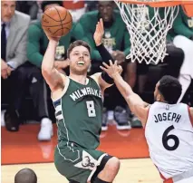  ?? ASSOCIATED PRESS ?? Bucks guard Matthew Dellavedov­a puts the ball up against the Raptors in Game 2. He has made just 31.6% of his shots in the series.