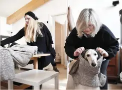  ??  ?? Fashion designer Giovanna Temellini adjusts an outfit on a greyhound dog in her workshop in Milan (File photo/AFP)