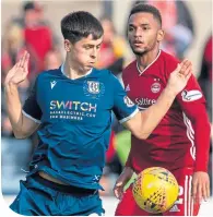  ??  ?? Callum Moore up against Aberdeen’s Funsu Ojo