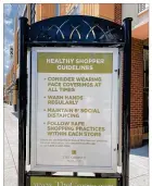  ?? PHOTOS BY COSETTE GUNTER / STAFF ?? Shopping guidelines posted by The Greene. Stores that reopen must follow state rules.