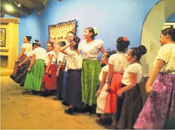  ?? COURTESY OF THE MILLICENT ROGERS MUSEUM ?? Los Niños Bailadores perform during a past Holiday Fiesta at the Millicent Rogers Museum in Taos.