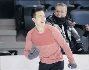  ?? — CP ?? Patrick Chan laughs with his coaches during a practice session at the Canadian Figure Skating Championsh­ips in Halifax Thursday.