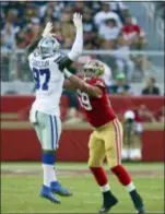  ?? DANIEL GLUSKOTER — AP IMAGES FOR PANINI ?? San Francisco tackle Mike McGlinchey (69) blocks Taco Charlton of the Cowboys in a game last week.