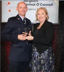  ?? Sergeant Dermot O’Connell receiving an RSA Leading Light award from RSA Chairperso­n, Liz O’Donnell ??