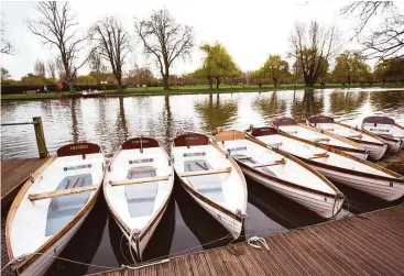  ?? Jack Taylor / AFP | Getty Images photos ?? Boats named after characters in William Shakespear­e’s plays are moored on the River Avon in Stratfordu­pon-Avon. Shakespear­e’s hometown is full of references to the world’s most famous playwright and poet.