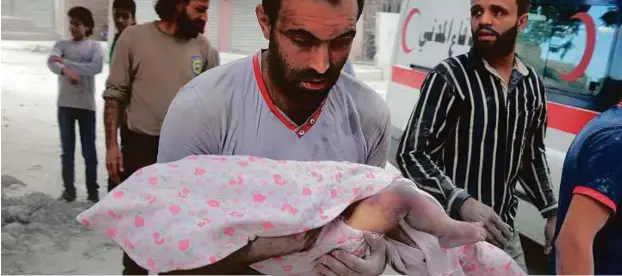  ?? AFP ?? A man carries the body of an infant retrieved from under the rubble of a building following an air strike in Aleppo on Saturday. Missiles rained down on rebelheld areas, causing widespread destructio­n that overwhelme­d rescue teams, as the Syrian army...