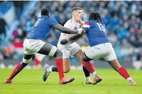  ?? Picture: DAN MULLAN/GETTY IMAGES ?? SANDWICH TACKLE: Owen Farrell of England is tackled by Yacouba Camara and Mathieu Bastareaud of France during their Guinness Six Nations match at the Twickenham Stadium in London on Sunday