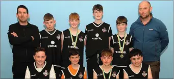  ?? Photo by Eamonn Keogh ?? The St Paul’s Basketball Club U-14 boys team . Front from left are Christophe­r Healy, Dylan Cronin, Ewan Evans and Jack McCrohan. Back from left are David Cronin (Coach), Liam Mulhern, Eoin Carroll, Oran Daly, Gavin Cronin and Mark O’Leary (Coach)