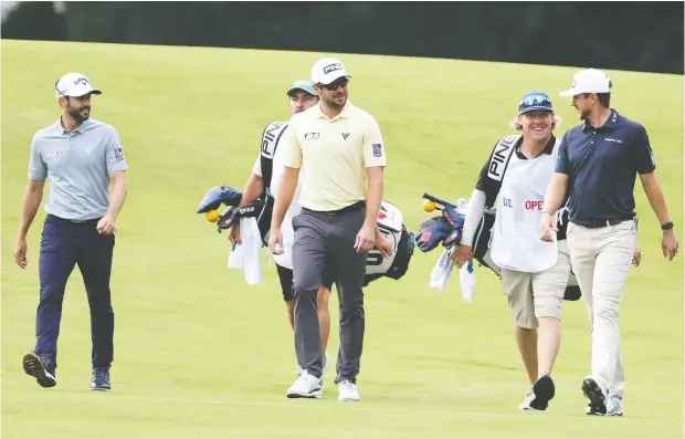  ?? Photos: Jamie Squire / Gett
y Imag
es ?? Adam Hadwin, Mackenzie Hughes and Corey Conners teed off early Thursday morning as an all- Canadian grouping at Winged Foot Golf Club in
Mamaroneck, N.Y. Conners finished the day as the low shooter in the group, carding a 1- over par 71. Hughes and Hadwin shot matching 72s.