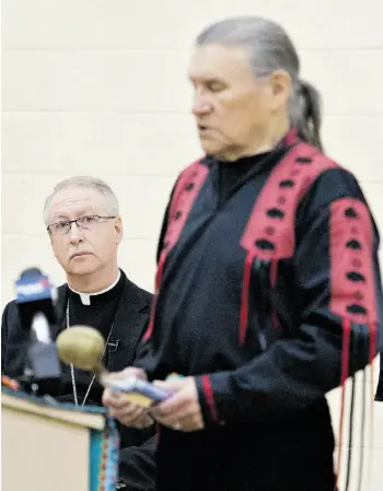  ?? JASON FRANSON/EDMONTON JOURNAL/FILE ?? Archbishop of Edmonton, Most. Rev. Richard Smith, watches as elder Jerry Woods says a prayer at Edmonton’s Ben Calf Robe School last month. The Truth and Reconcilia­tion Commission holds its final national event in Edmonton March 27 to March 30.