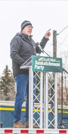  ?? MATT SMITH ?? Sask. Party Leader Scot Moe speaks to supporters in their vehicles during a rally held at Prairielan­d Park on Friday. Saskatoon Meewasin candidate Rylund Hunter was also at the event.