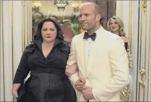  ?? Larry Horricks / Twentieth Century Fox ?? Melissa Mccarthy and co-star Jason Statham pose as a “happy” couple in “Spy,” one of the movies being shown as part of the Melissa Mccarthy Movie Marathon on FX.