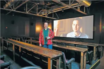  ?? [BRYAN TERRY/ THE OKLAHOMAN] ?? Hunter Wheat hoped a two-screen cinema set up for drinks and food, along with an adjoining pub, would draw crowds to Banquet Cinema Pub at 800 NW 4. The venue will show its last movies Saturday night.