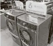  ?? Rick Bowmer / Associated Press ?? Kenmore washers and dryers are displayed at a Sears in West Jordan, Utah. Orders for durable goods climbed 6.5 percent in June.