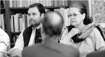  ??  ?? Sonia and Rahul look on at the Congress Working Committee (CWC) meeting at the Congress party headquarte­rs in New Delhi. — AFP photo
