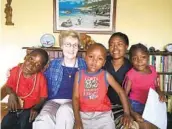  ?? COURTESY MARYKNOLL SISTERS VIA AP ?? Sister Janice McLaughlin is shown with children in Zimbabwe in 2018.