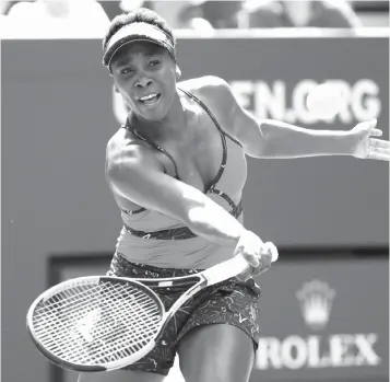  ?? Frank Franklin II/Associated Press ?? Venus Williams returns a shot to Camila Giorgi of Italy on Wednesday during the second round of the U.S.Open in New York.