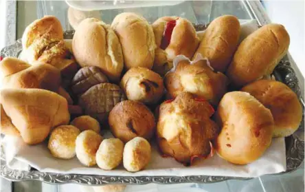  ??  ?? One of the bestsellin­g products of the Progreso Women and Workers Multi-Purpose Cooperativ­e (PWWMPC) is their “milky bread,” which is made from native carabao’s milk. The milk is mixed with flour instead of water and processed into 10 different kinds...