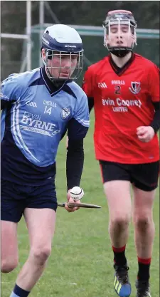  ??  ?? Cathal Murphy on the move for St. Anne’s as Jack Stamp (Oulart-The Ballagh) looks on during their Martin Storey Cup final on Sunday.