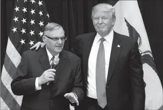  ?? ASSOCIATED PRESS FILE PHOTO ?? IN THIS JAN. 26, 2016, PHOTO, REPUBLICAN PRESIDENTI­AL candidate Donald Trump is joined by Maricopa County Sheriff Joe Arpaio at a campaign event in Iowa. Arpaio says he isn’t asking President Donald Trump to issue a pardon for his misdemeano­r...