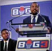  ?? BEBETO MATTHEWS — THE ASSOCIATED PRESS ?? In this Jan. 11 photo, entertaine­r Ice Cube, right, announces the launch of the Big3 profession­al basketball league as former NBA player and players union deputy Roger Mason, left, looks on, in New York. Ice Cube says his Big3 basketball league is open...
