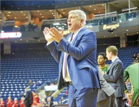  ?? SAM BLUM — SBLUM@DIGITALFIR­STMEDIA.COM ?? Jimmy Patsos coaches during a game at Fairfield in January. He spoke with The Record about his roster heading into summer workouts.