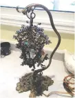  ??  ?? This wrought iron lamp has style.