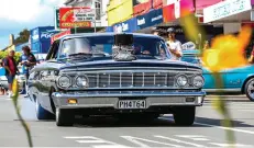  ??  ?? The heart of the Hop is gas-swilling, baritone-rumbling, pushrod V8s, and, as far as standouts at Waihi were concerned, it was more Blue Oval goodness. Justin Walker’s chopped, tubbed, and slammed ’64 Ford Galaxie drew almost everyone in town. They...