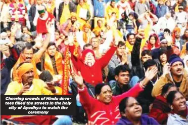  ?? ?? Cheering crowds of Hindu devotees filled the streets in the holy city of Ayodhya to watch the ceremony