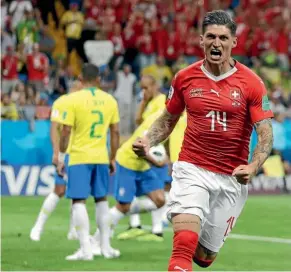  ?? AP ?? Steven Zuber celebrates after scoring Switzerlan­d’s goal in the 1-1 draw with Brazil in their Group E match.