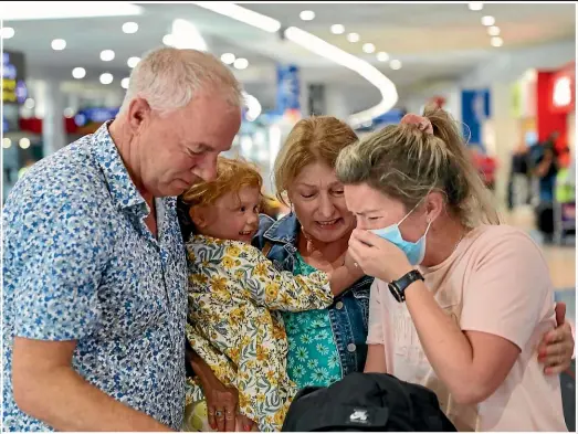  ??  ?? Tears flowed at Auckland Internatio­nal Airport yesterday as family were finally reunited.
RYAN ANDERSON/STUFF