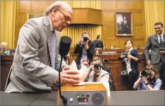  ?? Andrew Harnik / Associated Press ?? Rep. Steve Cohen, D-Tenn., left, places a prop chicken on the witness desk for Attorney General William Barr after he does not appear before a House Judiciary Committee hearing on Capitol Hill on Thursday.