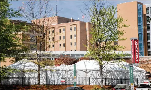  ?? CONTRIBUTE­D BY STEVE SCHAEFER ?? The newly constructe­d tents outside Northside Hospital’s emergency department is part of an effort throughout the state to create space for more beds and ICU units, while securing more ventilator­s, masks, gowns and other crucial equipment and supplies.