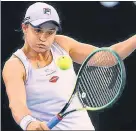  ??  ?? Ashleigh Barty hits a return against Shelby Rogers on Monday.