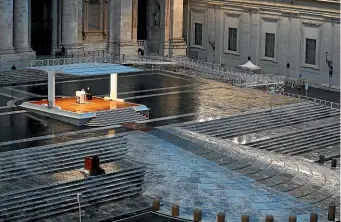  ??  ?? Pope Francis delivers an Urbi et Orbi prayer from the empty St Peter’s Square at the Vatican yesterday. He likened the coronaviru­s pandemic to a storm laying bare illusions that people can be self-sufficient.