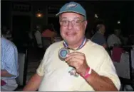  ?? KEVIN TUSTIN — DIGITAL FIRST MEDIA ?? Michael Camma earned his bronze medal in the mens 60-64 age division for singles bowling. Bowling was this year’s most popular sports with over 100 of the 700 game participan­ts involved in the mixed teams, singles and doubles events.