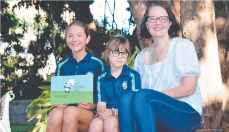  ?? ?? Bernadette Lewis, Luca and Billie with a copy of Luca's book, Paisley Panda. Picture: Daniel Shirkie