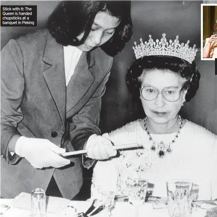  ?? ?? Stick with it: The Queen is handed chopsticks at a banquet in Peking