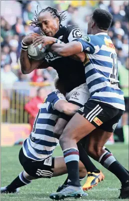  ??  ?? MAN IN THE MIDDLE: Sharks wing Odwa Ndungane is tackled by Western Province’s Justin Phillip, left, and Damian Willemse during yesterday’s Currie Cup match at in Cape Town. DARRYN POLLOCK
