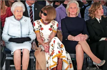  ?? ?? FASHION TIPS: Ms Kelly, third from left, joins the Queen and Anna Wintour at London Fashion Week