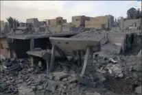  ?? AAMAQ NEWS AGENCY, THE ASSOCIATED PRESS ?? This image purports to show destroyed houses following a U.S.-led coalition strike in the eastern Syrian town of Boukamal.