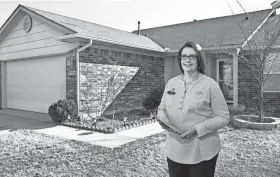  ?? THE OKLAHOMAN FILE ?? Kathy Fowler stands outside a house she had listed for sale in southwest Oklahoma City.