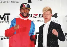  ?? Reuters ?? Floyd Mayweather Jr. with Tenshin Nasukawa during the announceme­nt of the New Year’s Eve bout.