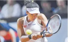  ??  ?? Japan’s Naomi Osaka returns the ball to Taiwan’s Su-Wei Hsieh during their round-of-16 match. — AFP photo