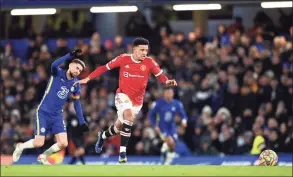  ?? Shaun Botterill / Getty Images ?? Manchester United’s Jadon Sancho, right, breaks away before scoring his side’s first goal against Chelsea on Sunday.
